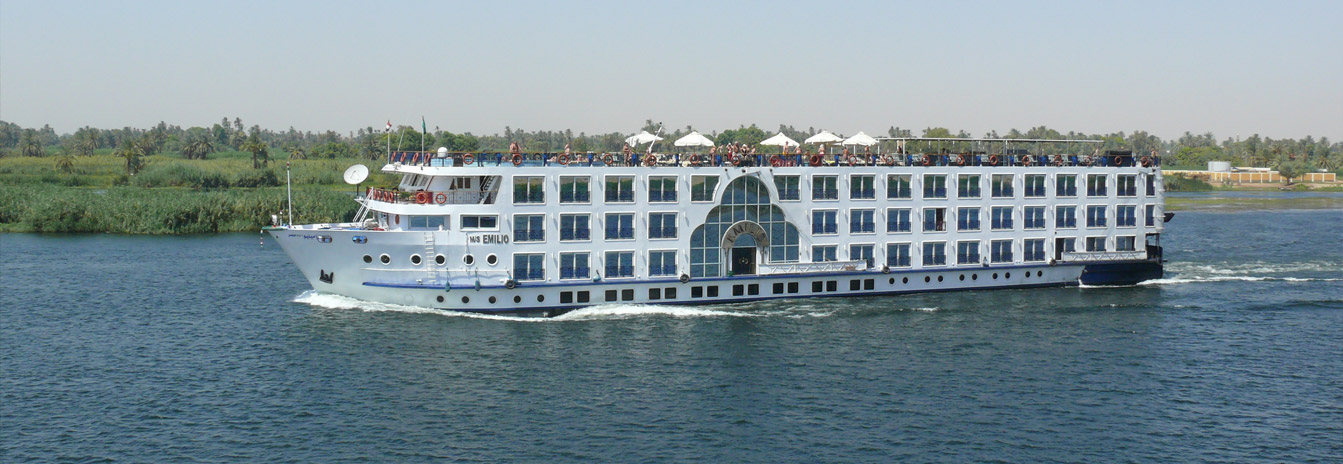 A luxury 5-star Nile Cruise ship sailing through the tranquil waters of the Nile in Upper Egypt